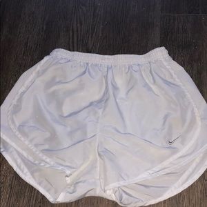 White Nike running shorts